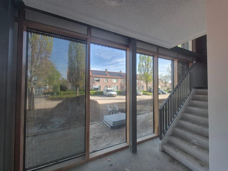 De functionaliteit van aluminium en de warme uitstraling van hout.